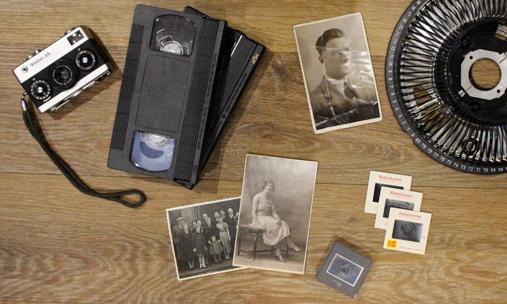 Vintage film camera and old photographs for scanning and digitisation.